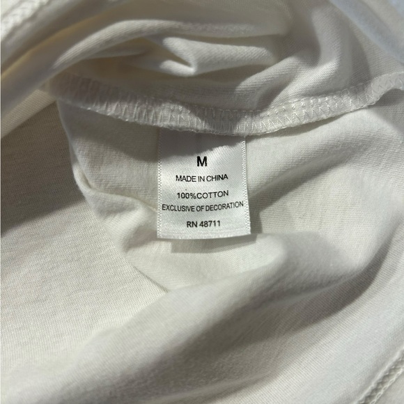 An Ophelia Roe short sleeved white pullover blouse with top and sleeve eyelets - Picture 6 of 8